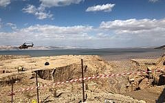 A Jordanian helicopter hovers over an area after flash floods near the Dead Sea, Jordan,  (AP Photo/Omar Akour)