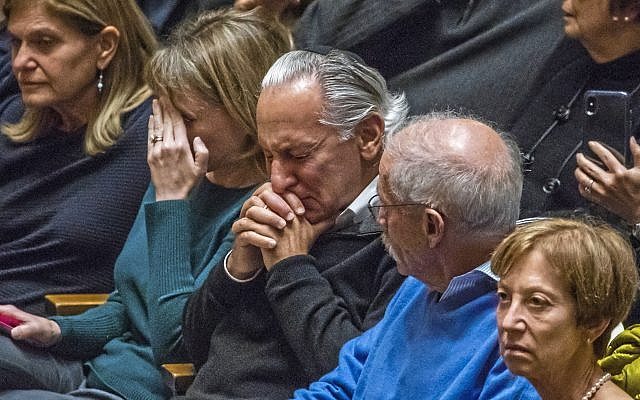 People gather at Soldiers & Sailors Memorial Hall for a vigil to remember the victims of the mass shooting a day earlier at the Tree of Life Synagogue, Sunday, Oct. 28, 2018, in Pittsburgh. (Andrew Rush/Pittsburgh Post-Gazette via AP)
