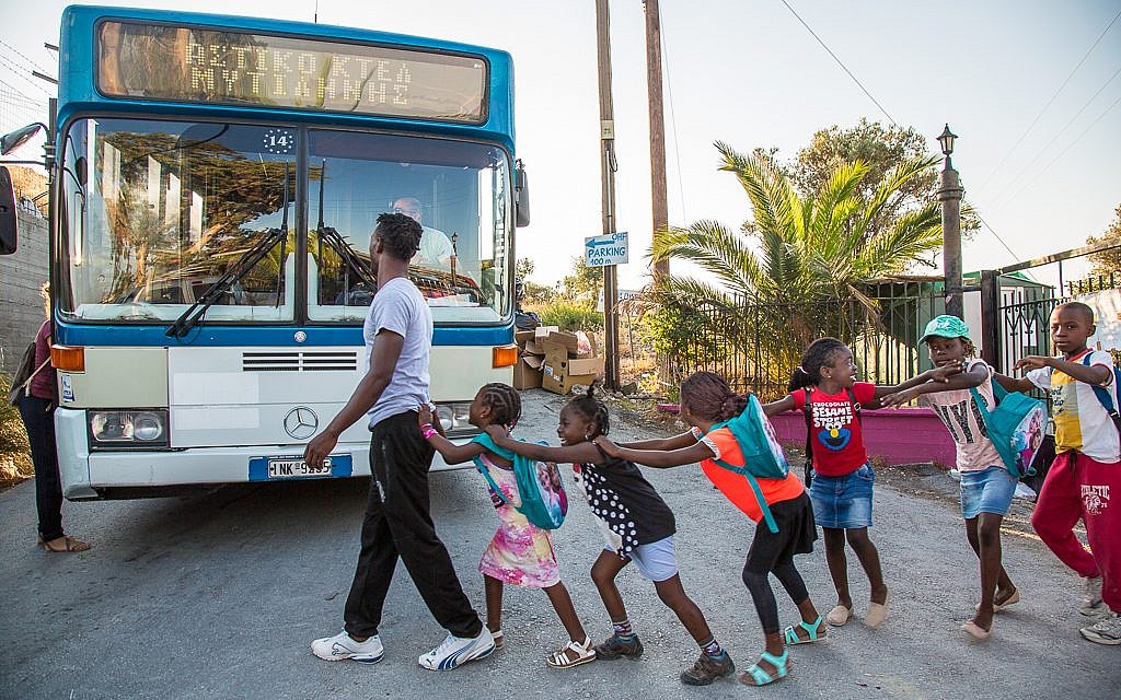 At the end of the school day, the students at the School of Peace return home to refugee camps. Photo - Lisa Kristine At the end of the school day, the students at the School of Peace return home to refugee camps. Photo - Lisa Kristine
