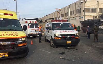 Emergency workers at the scene of the terror attack at the Barkan industrial area