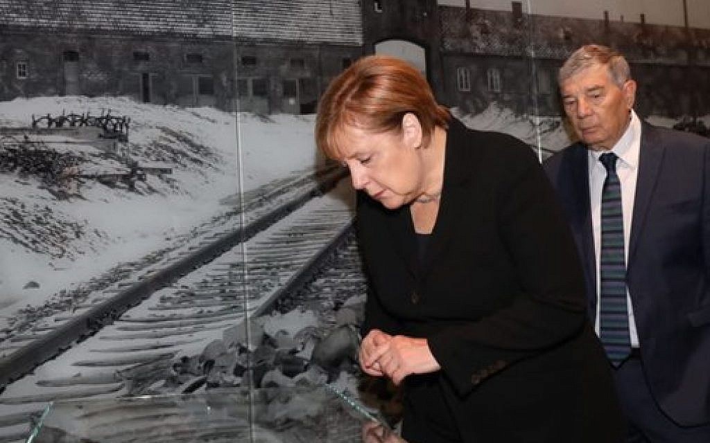 German Chancellor Angela Merkel during her state visit to Israel. Here she tours Israel national Holocaust memorial museum, Had Vashem. Credit: Had Vashem on Twitter