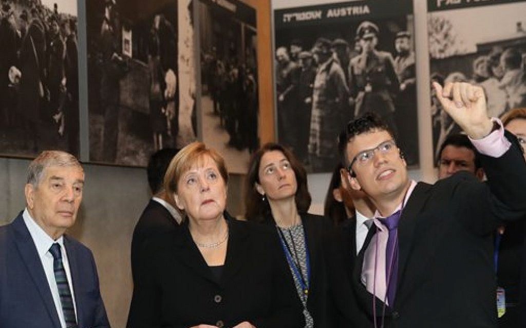 German Chancellor Angela Merkel during her state visit to Israel. Here she tours Israel national Holocaust memorial museum, Had Vashem. Credit: Had Vashem on Twitter