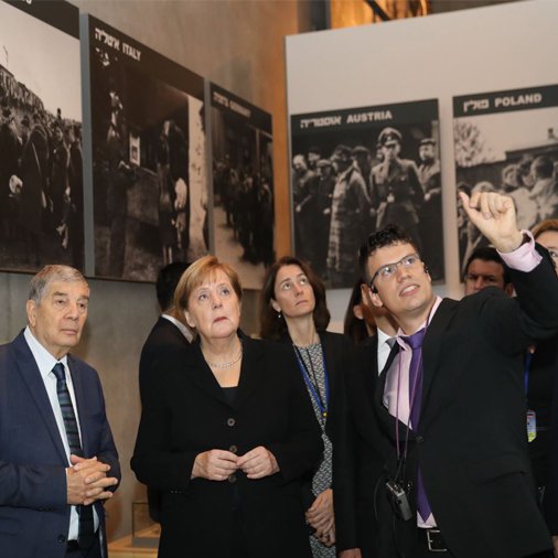 German Chancellor Angela Merkel during her state visit to Israel. Here she tours Israel national Holocaust memorial museum, Had Vashem. Credit: Had Vashem on Twitter