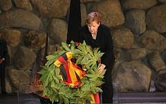 German Chancellor Angela Merkel lays a wreath during her visit to Israel's national Holocaust memorial museum, Had Vashem. Credit: Had Vashem on Twitter German Chancellor Angela Merkel lays a wreath during her visit to Israel's national Holocaust memorial museum, Had Vashem. Credit: Had Vashem on Twitter