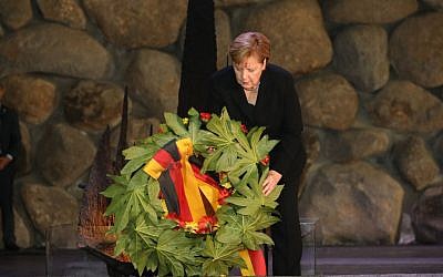 German Chancellor Angela Merkel lays a wreath during her visit to Israel's national Holocaust memorial museum, Had Vashem. Credit: Had Vashem on Twitter