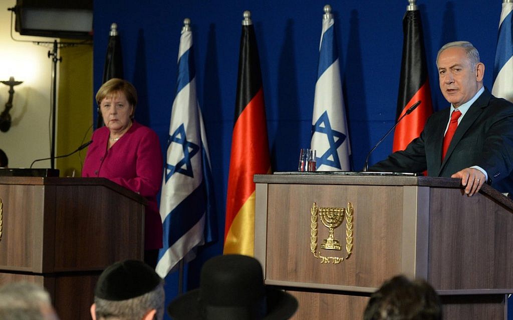 Benjamin Netanyahu with Angela Merkel during her state visit to Israel in 2018. (Credit: Israeli PM / Benjamin Netanyahu on Twitter.)
