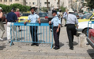 Two Palestinian police in front of Church of the Nativity. (Credit: James Emery via Wikimedia Commons)