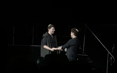 The two fans on stage during the concert
