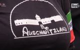 The woman's top with 'Auschwitzland' on it.