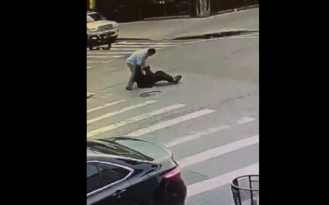 Screenshot from a video showing the incident in which the man is beaten up