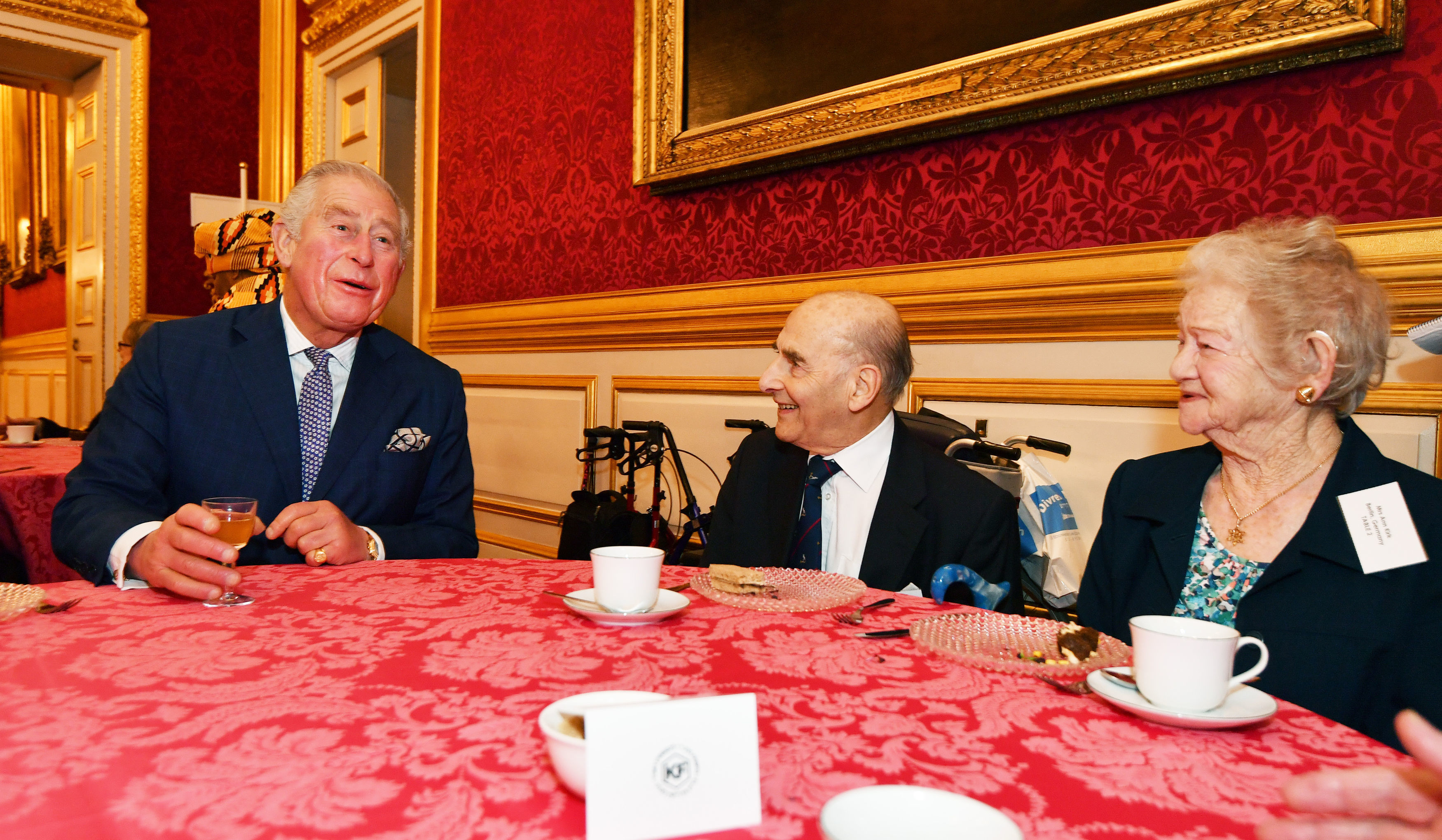 The Prince of Wales meets guests Bob and Ann Kirk, who were married after arriving in the UK alone from Germany, during a reception for the Association of Jewish Refugees in London, which marks the 80th anniversary of the Kindertransport.  Photo credit: John Stillwell/PA Wire