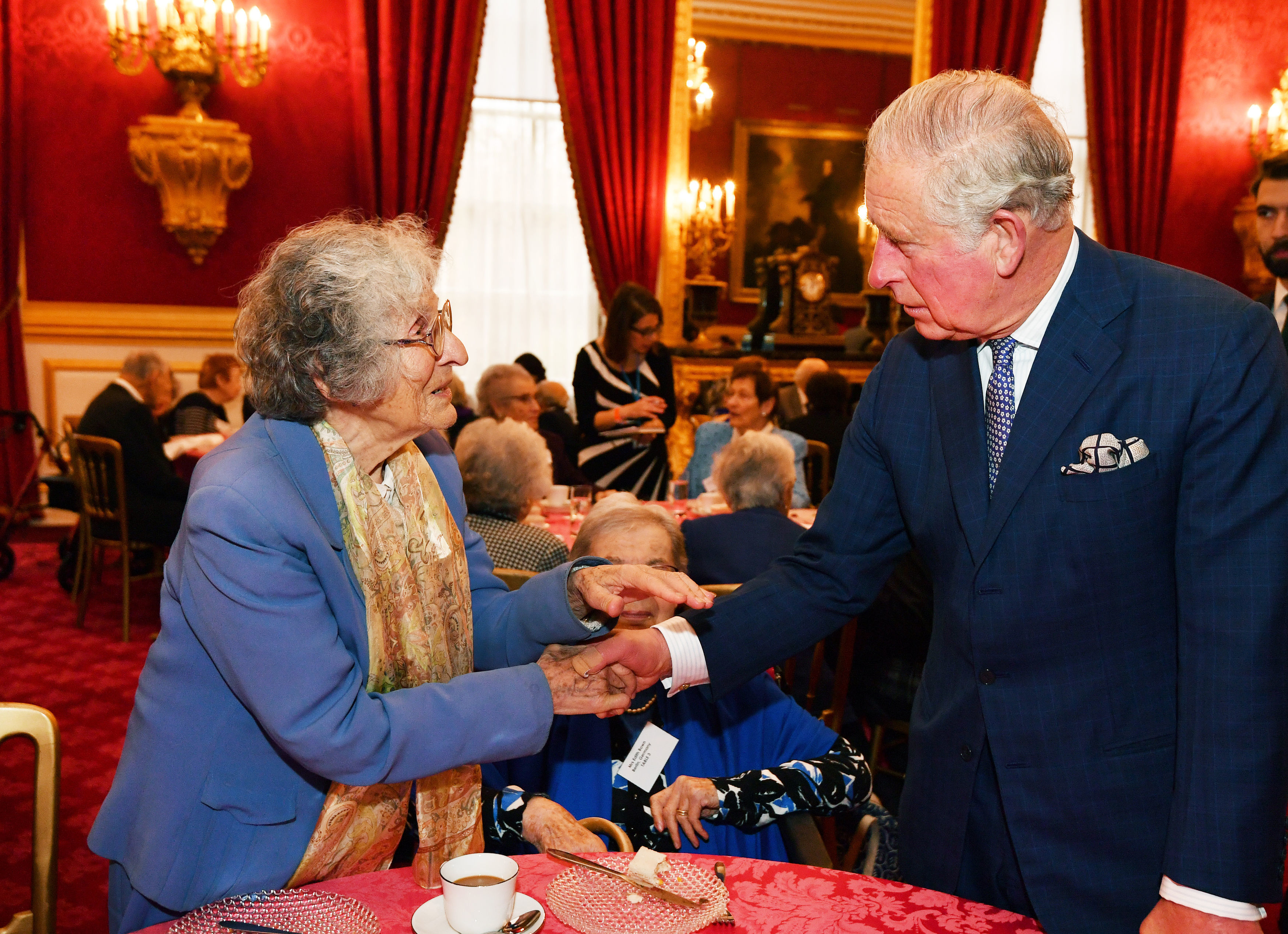 The Prince of Wales meets guest Dr Elizabeth Rosenthal, during a reception for the Association of Jewish Refugees in London, which marks the 80th anniversary of the Kindertransport. Photo credit: John Stillwell/PA Wire