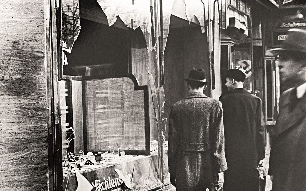 Pedestrians viewing a Jewish-owned store in Berlin damaged during Kristallnacht, November 10, 1938.