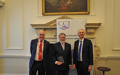 Lord Michael Howard, Rabbi Lord Sacks with his award, and David Lidington