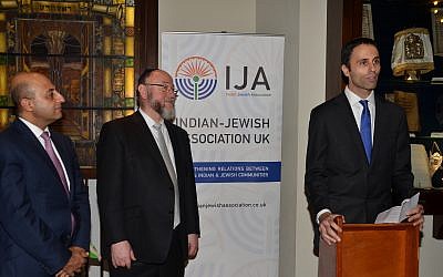 Lord Gadhia and Chief Rabbi Mirvis watching Zaki Cooper speak during the event at Marble Arch shul