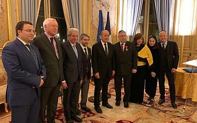 Conference of European Rabbis president Pinchas Goldschmidt (fourth from right) receiving his Legion of Honour Award in Paris from French Foreign Affairs Minister Jean-Yves Le Drian (fifth from right)
