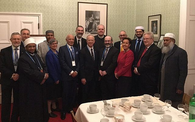 Members of the the National Council of Imams and Rabbis of the Joseph Interfaith Foundation present the specially commissioned card for HRH the Prince of Wales seventieth birthday