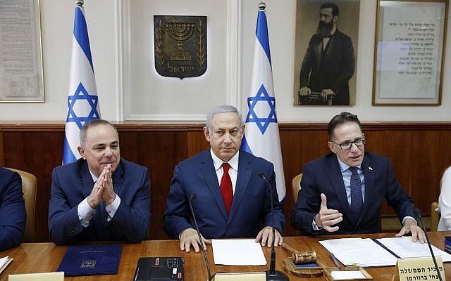 Israeli Prime Minister Benjamin Netanyahu, center, Government Secretary Tzahi Braverman, center right, Yuval Steinitz Israel's Minister of Energy, center left, in charge of Israel Atomic Energy Commission attend the weekly cabinet meeting at the prime minister's office in Jerusalem, Sunday, Nov. 18, 2018. (Abir Sultan/Pool via AP)