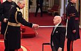 Sir Ben Helfgott is made a Knight Bachelor of the British Empire by the Prince of Wales during an Investiture ceremony at Buckingham palace, London.