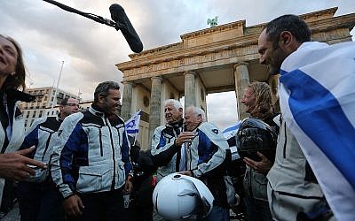 The riders arrive at Brandenburg Gate in Back To Berlin