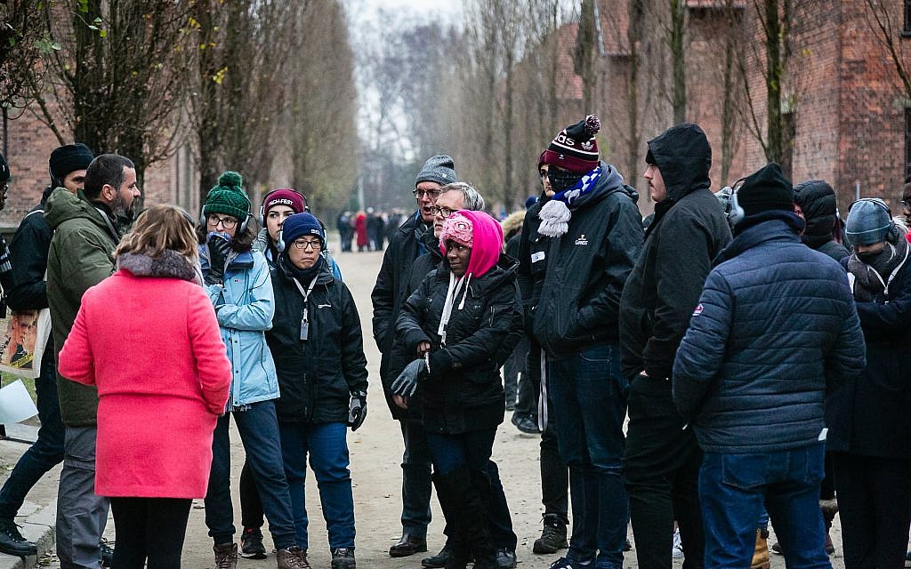 Students learn about the former Nazi death camp from a guide.  Photo credit: Yakir Zur