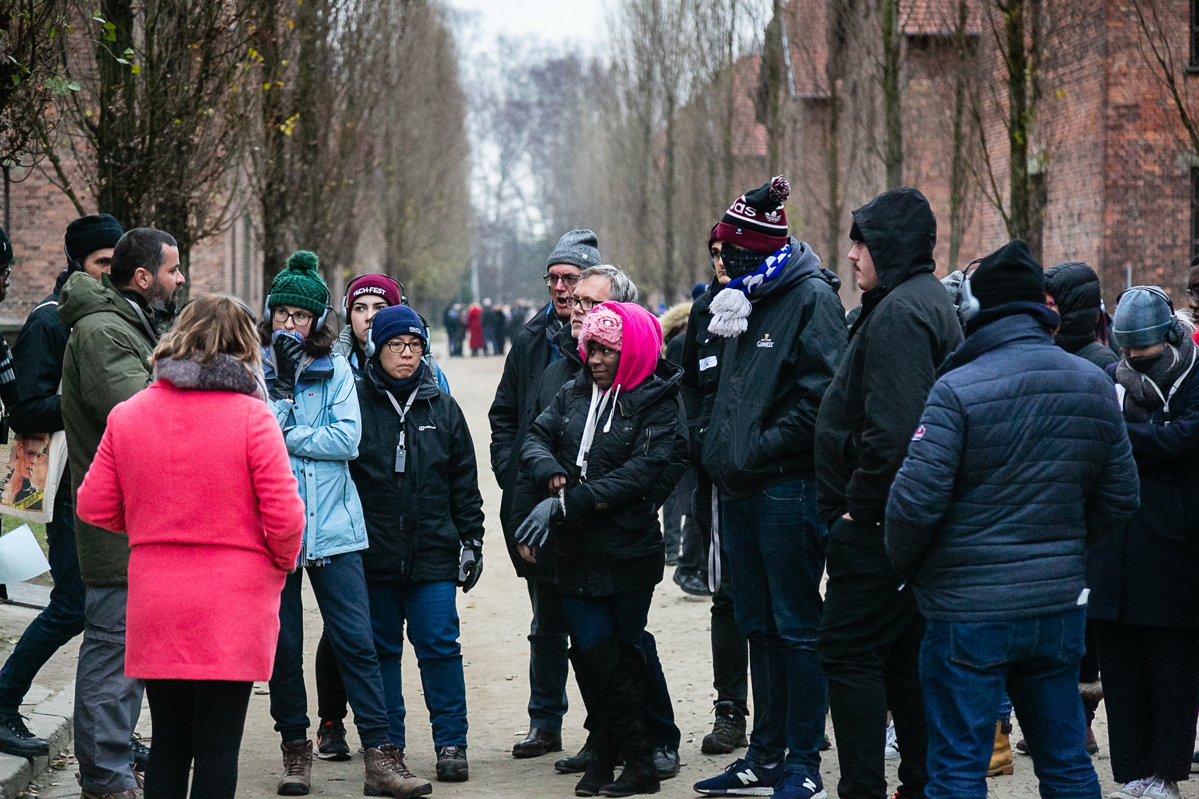 Students learn about the former Nazi death camp from a guide.  Photo credit: Yakir Zur