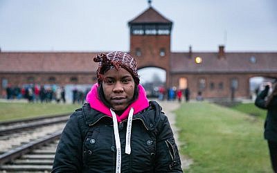 Shakira Martin, NUS president, with the infamous Auchwitz death gate in the background