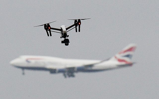 A drone and an aircraft, amid the chaos at Gatwick airport after drones were spotted over the airfield. Photo credit: John Stillwell/PA Wire