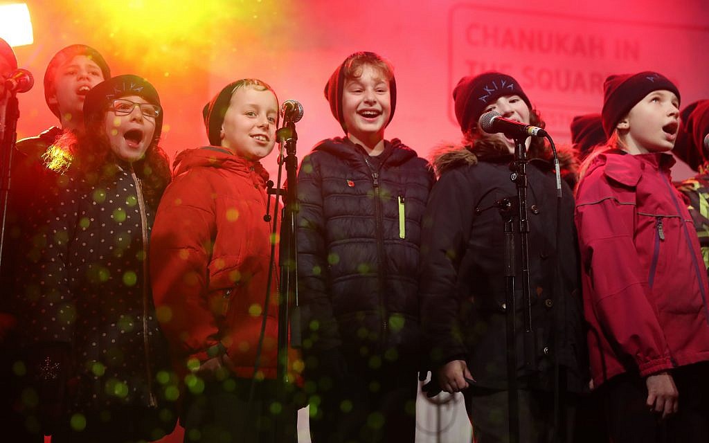 Youngsters in fine voice on stage during Chanukah in the Square. Pic: Marc Morris.