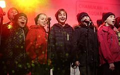Youngsters in fine voice on stage during Chanukah in the Square. Pic: Marc Morris. Youngsters in fine voice on stage during Chanukah in the Square. Pic: Marc Morris.