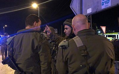 Soldiers at the scene of the shooting in the West Bank