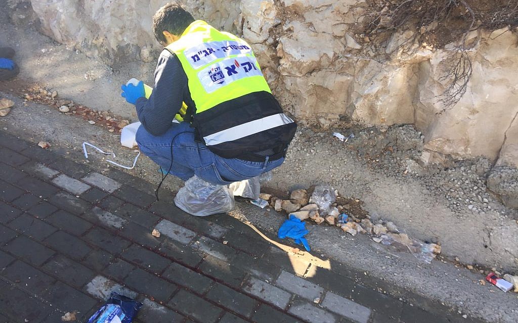 West Bank shooting attack which killed two. Medics and emergency workers at the scene: 
Photos courtesy Eliyahu Dahari/ZAKA