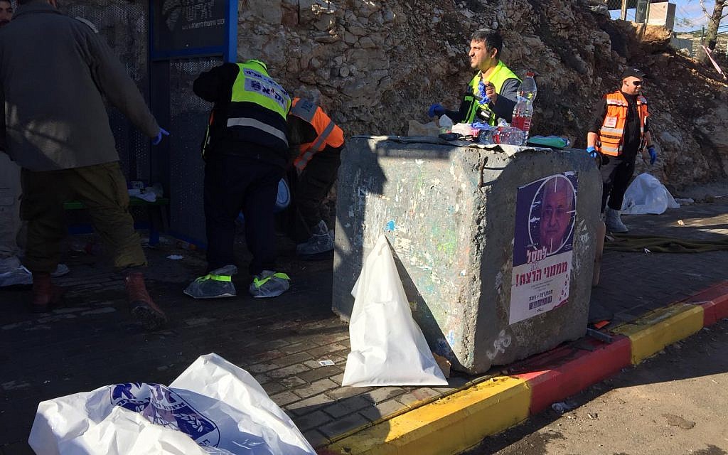 West Bank shooting attack which killed two. Medics and emergency workers at the scene: 
Photos courtesy Eliyahu Dahari/ZAKA