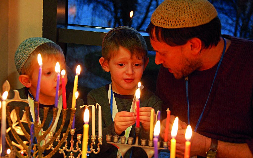 Young children light the Chanukiah during a previous Limmud