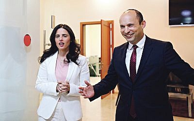 Israeli Education Minister Naftali Bennett (R) and Justice Minister Ayelet Shaked, from the Jewish Home party