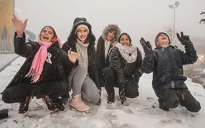 Israeli children experience the snowy conditions. Credit: Ancho Gosh