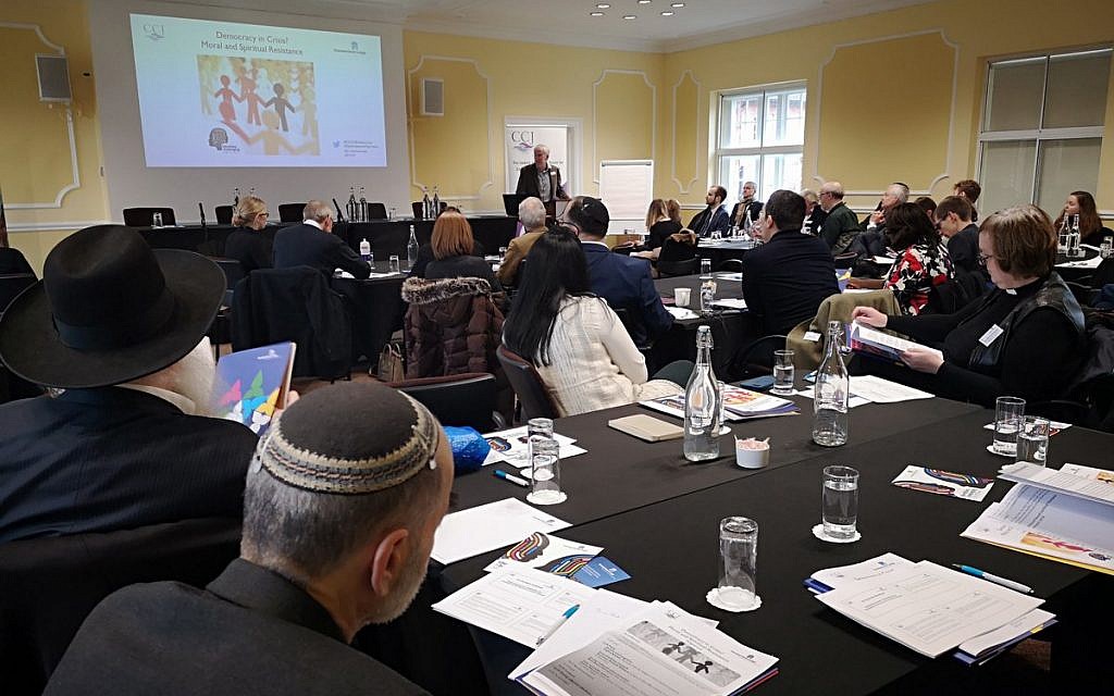 Guests at the CCJ's event listen to a speaker