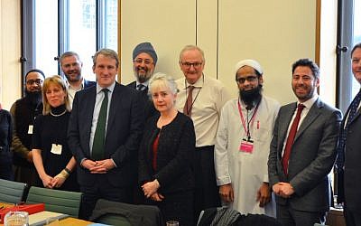 Faith leaders, including a representative of the Board of Deputies (second right) attend the meeting on academisation