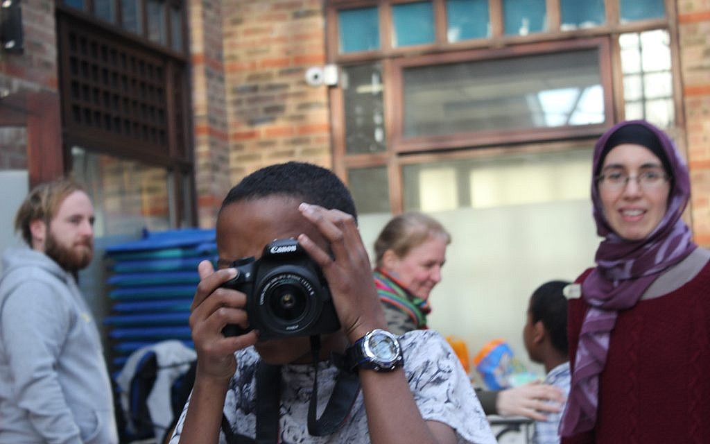 Say cheese! Young man takes a snap on a camp for children who were traumatised by the Grenfell disaster, run in-part by Jewish activists