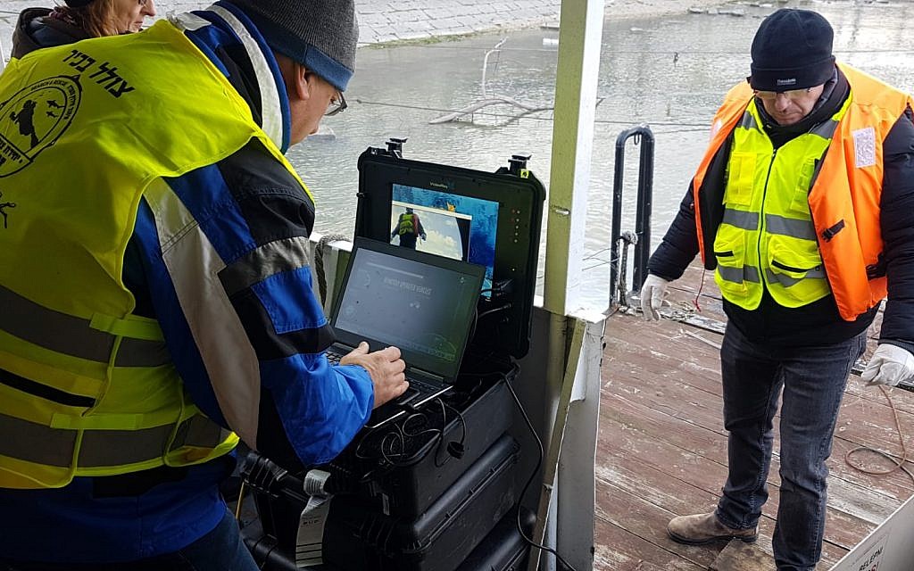 Zaka volunteers during the first phase of the search along the Danube river floor. Photos credit ZAKA