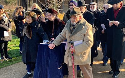 Survivors, including Harry Bibring on the right, escorting the coffin containing the remains of six Holocaust victims to their grave at Bushey New Cemetery.