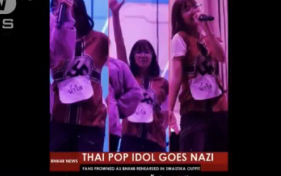 Screenshot from video, showing Thai band BNK48 with Nazi Tshirts on.