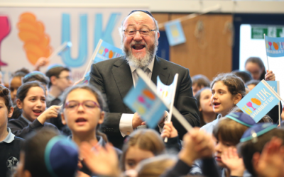 The Chief Rabbi performing with schoolchildren.