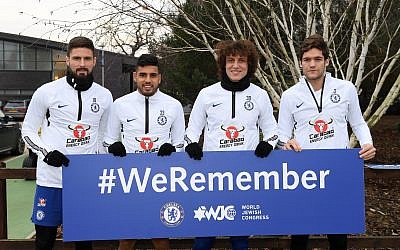 Chelsea players at the club's training ground holding up a #WeRemember sign. L-R: Olivier Giroud, Emerson Palmieri, David Luis and Marcos Alonso

 
 (Photo by Darren Walsh/Chelsea FC via Getty Images)