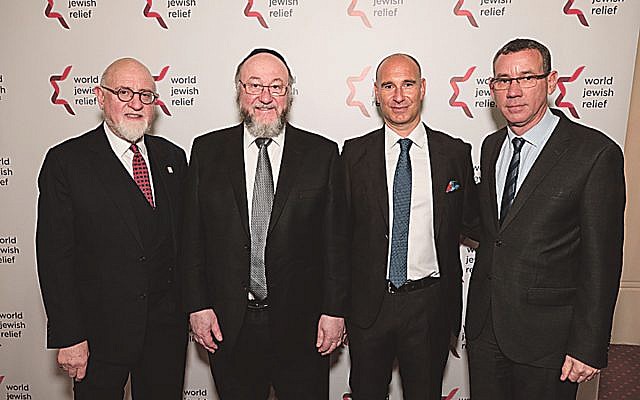 Guests at the World Jewish Relief dinner included WJR President Henry Grunwald (left)m Chief rabbi Mirvis (to his right) and Israeli envoy to the UK, Mark Regev.