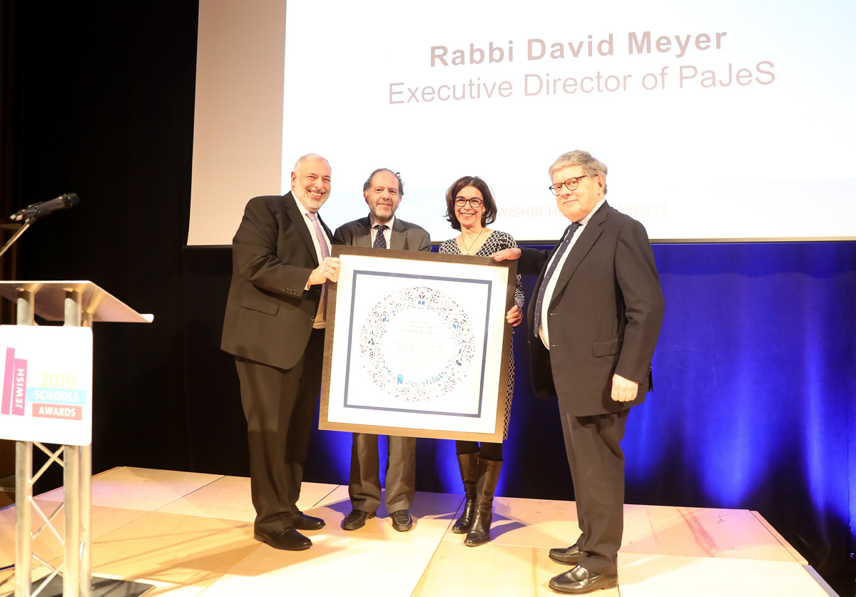 Professor David Latchman (centre-left) with Rabbi David Meyer (left) after receiving his Lifetime Achievement Award, at the Jewish Schools Awards (Marc Morris Photography)