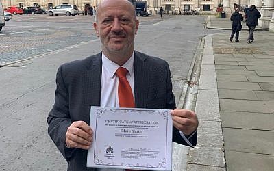 Edwin Shuker with his certificate from the foreign office