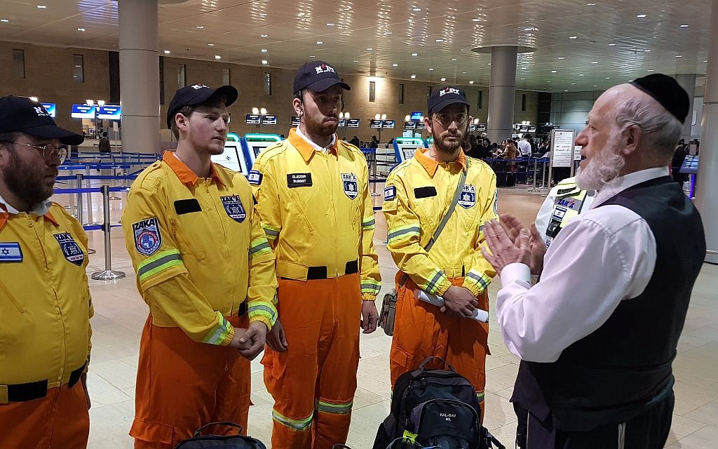 ZAKA Chairman Yehuda Meshi-Zahav gives the Israel team a final briefing before they depart for Ethiopia. Credit: ZAKA
