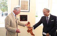 The Prince of Wales puts on his kippah as he arrives for his visit to the Nidhe Israel synagogue, Bridgetown, Barbados, where he unveiled a plaque and saw the Mikvah, as he continues his tour of the Caribbean. (Photo credit: Jane Barlow/PA Wire)