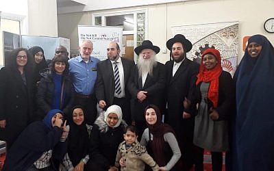 Jeremy Corbyn in the back row with a light blue shirt, and Rabbi Gluck two to the right of him.
